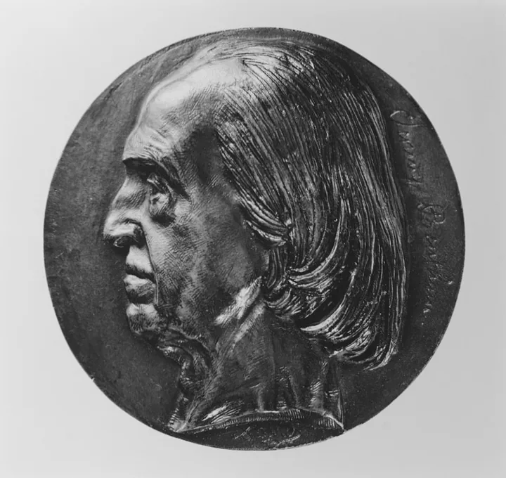 Black-and-white photograph of a round relief portrait of Jeremy Bentham in left-facing profile.
